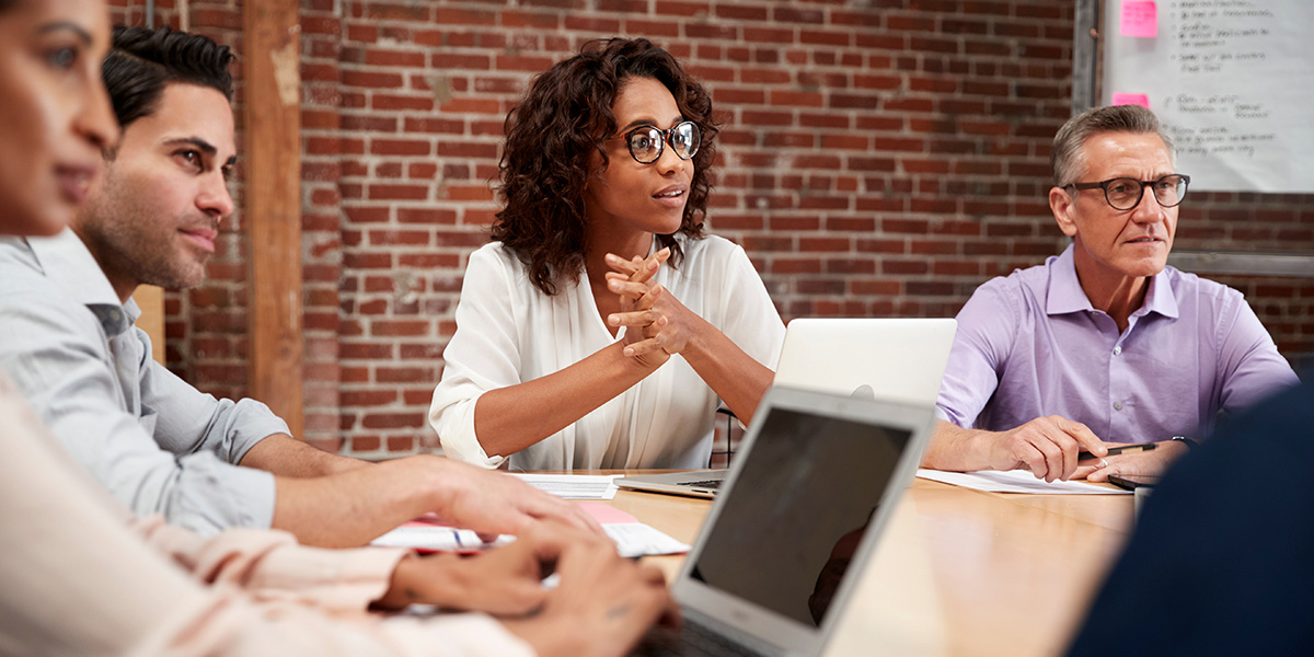 Diverse professionals collaborating in a meeting